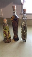 3 decorative bottles of peppers from Pier 1