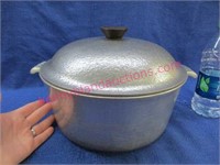 old aluminum pot with lid