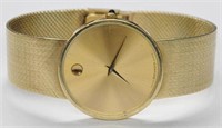 14K MOVADO MEN'S WATCH WITH 14K BAND.