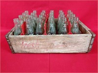 Vintage Coke Bottles in 7Up Crate