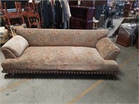 Large green floral sofa