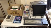 Amstrad CPC6128 Computer with books and floppy