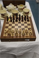 Chess set with box under board.