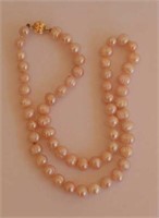 String pastel pink pearls 14ct gold clasp