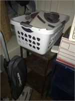TWO METAL CARTS AND LAUNDRY BASKET