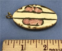 Unusual fossilized ivory pendent, inlaid with pink