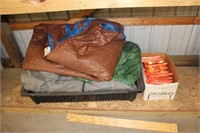 Shelf with safety vests, ice sled with tarps,tents