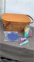 Picnic basket with plastic cups plates and