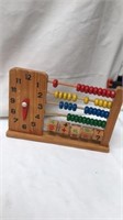 Vintage wooden counter with plus and equals