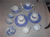11 pc lot of white&blue dishes and teapot.