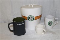 Starbucks coffee canister, mug and a cappuccino