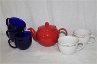 Red teapot, cobalt blue mugs and 2 hot chocolate