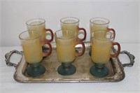 Frosted glass footed mugs on silver tray