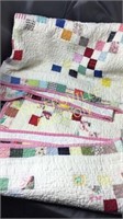 Old hand made quilt well worn