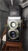 Vintage Kodak reflex camera in leather case