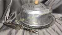 Vintage metal cake topper with glass cake plate