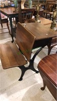 Antique school desk with a metal frame in a