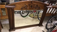 Fancy oak framed beveled mirror, with a pair of