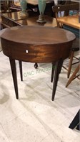 Antique mahogany tapered leg oval table with