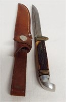 Western fixed blade knife with leather sheath.