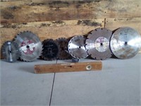 7 saw blades and 1 wooden level