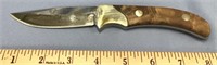 8 1/2" long hunting knife, etched blade, brass acc