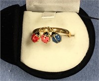 Gold toned ladies ring with 3 small ladybug bangle