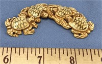 3.1/4" long fossilized bone carving of 4 turtles