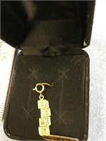 14kt Gold pendant says "Girl"