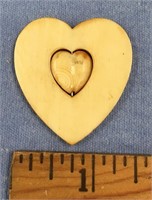 Heart shaped fossilized ivory token