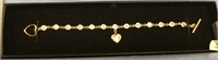 Gold toned bracelet with cubic zirconium inlays