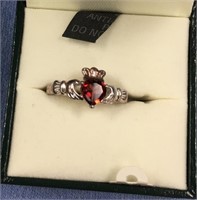 Woman's sterling silver Claddaugh ring, has ruby c
