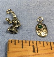 Lot of 2 sterling silver pendants: 1 says earth, o