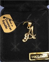 14kt gold pendant with initial "A" with a tiny pea