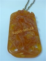 Carved Raw Amber Pendant
