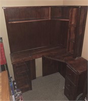 Dark stained wooden corner desk