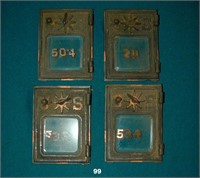 Four brass mailbox doors