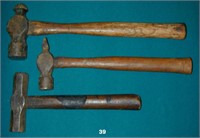 Three metal working hammers