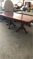 Ornately carved table has some damage
