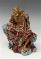 CHINESE RED GLAZE PORCELAIN LO-HAN FIGURE
