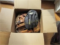 Box of baseball gloves and balls