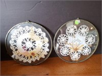 Doilies in glass trivets