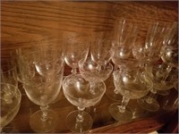 BOTTOM SHELF FULL OF ASSORTED GLASSES