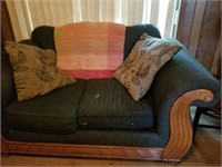 GREEN LOVESEAT WITH PILLOWS