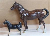 2 cast iron horses - largest -10" tall