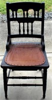 Chair with tooled leather seat