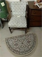 Upholstered captains chair and rugs