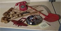 Toy Telephone, croquet, metal airplane, marbles,