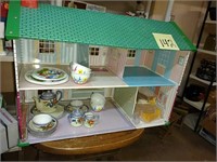 Metal dollhouse with furniture and toy tea sets