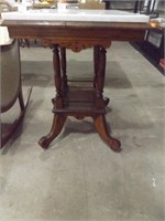 EAST LAKE MARBLE-TOP TABLE ON CASTORS